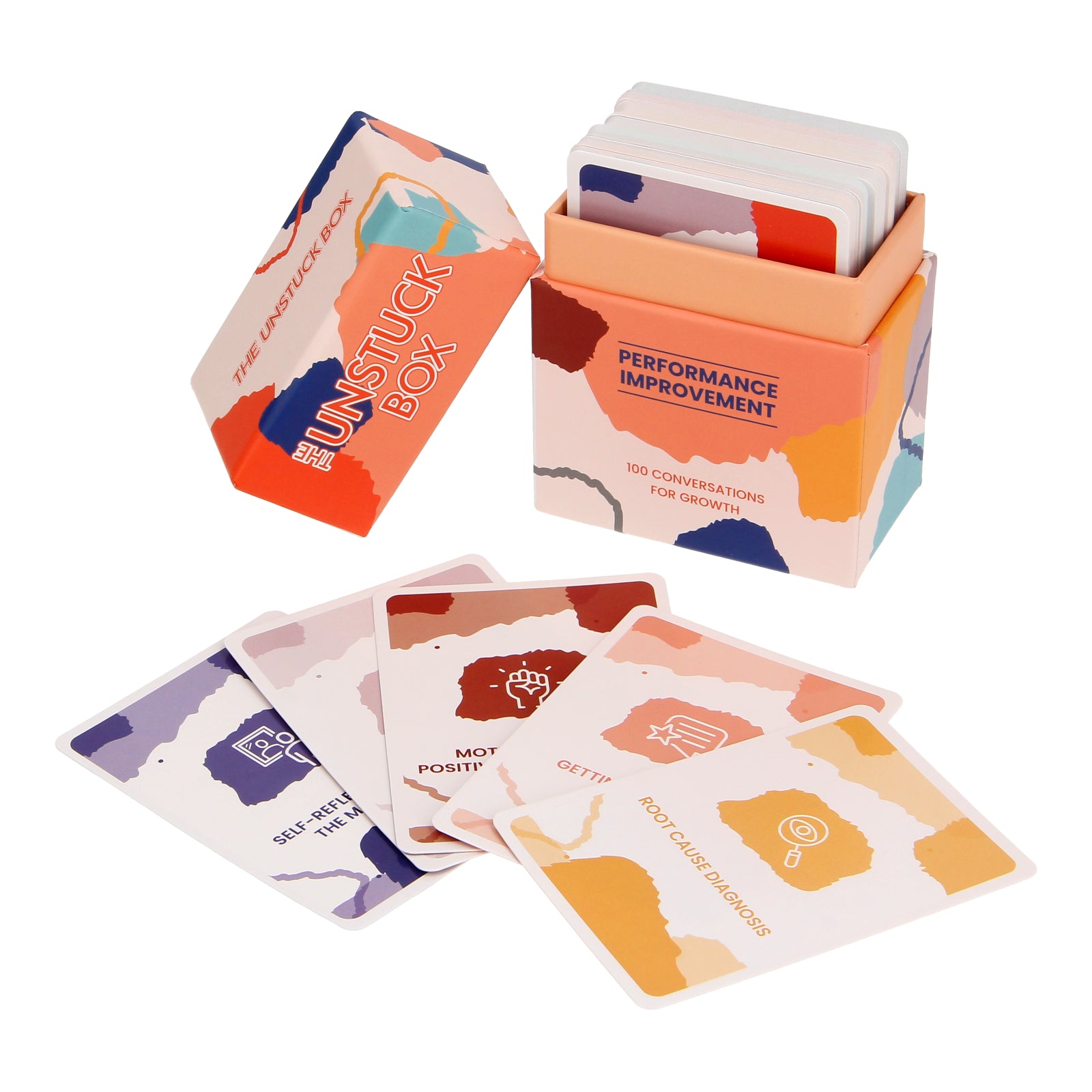 The Unstuck Box: Performance Improvement, featuring a colorful box with cards, designed to enhance performance management through 100 targeted prompts and expert guidance.
