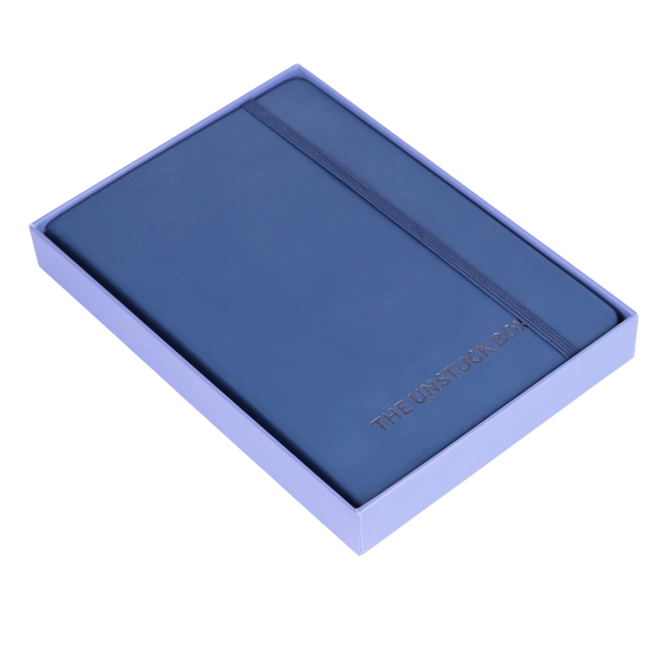 The Unstuck Box®: One to Ones Planner, a hardcover journal with 240 pages, features structured meeting prompts, note sections, and dual bookmarks for efficient 1-1 meeting management.