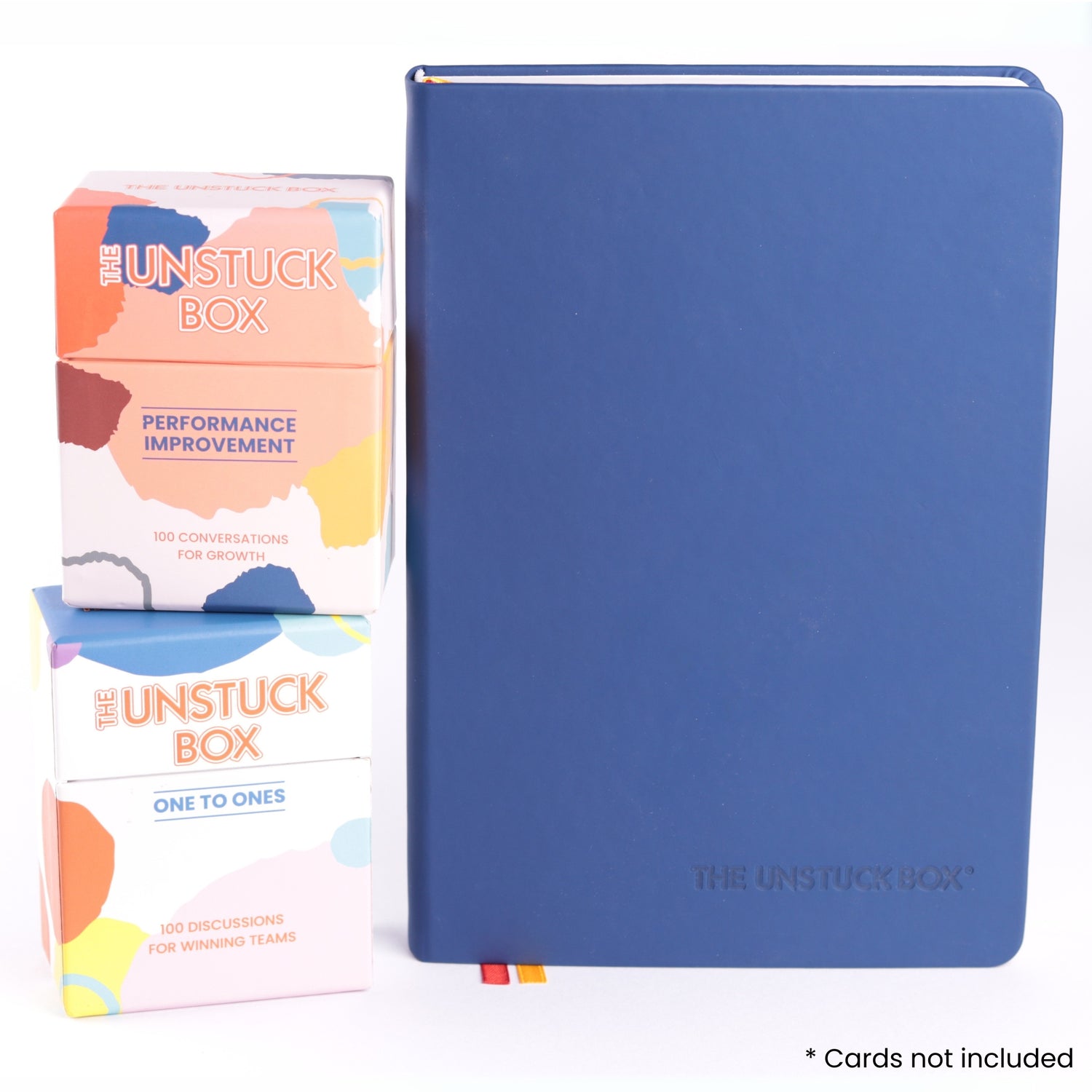 The Unstuck Box®: One to Ones Planner, a hardcover book with elastic closure and ribbon bookmarks, designed for managers to enhance 1-1 meeting effectiveness.