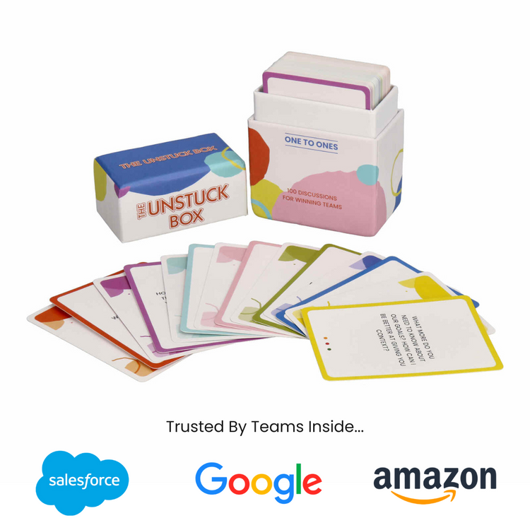 The Unstuck Box: One to Ones featuring 100 prompt cards for managers to improve team communication and productivity, displayed with cards partially inside and outside the box.