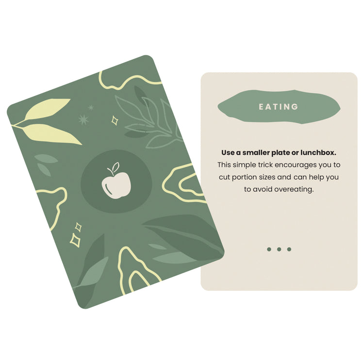The Unstuck Box: Workday Wellness deck features a card with a white apple and leaf illustration, designed to enhance health and productivity at work.