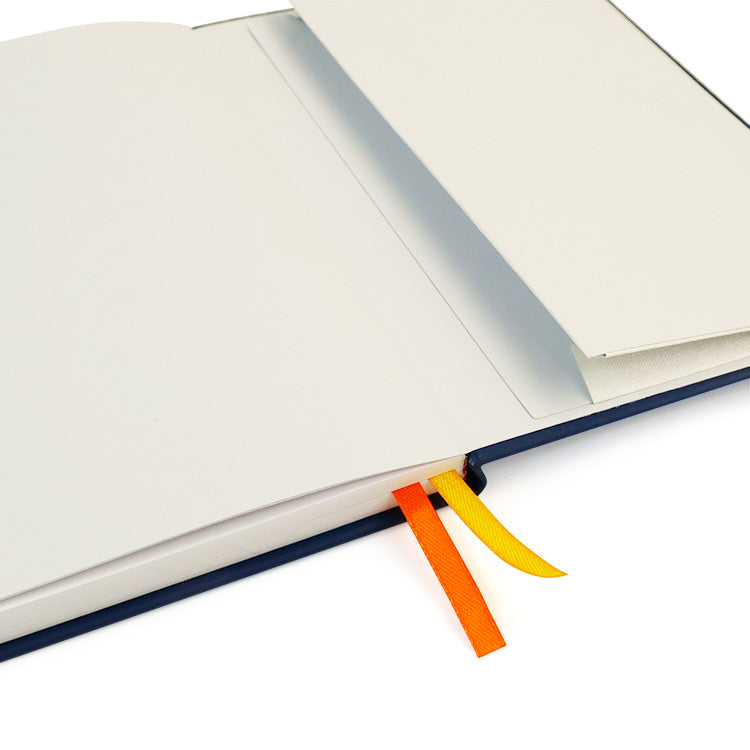 Open notebook with colorful ribbon bookmark on a white background