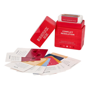 The Unstuck Box®: Conflict Resolution, featuring a red box containing a deck of cards with strategies for managing workplace conflicts and fostering collaboration.