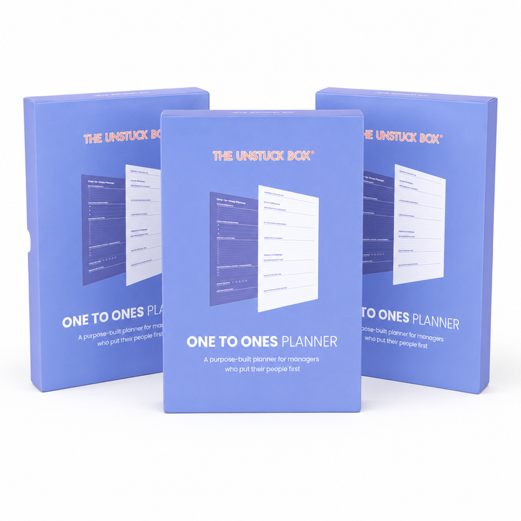 Three One to Ones Planners arranged as a small team pack
