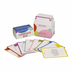 The Unstuck Box: One to Ones, a deck of 100 cards with thought-provoking prompts, displayed alongside its box and several cards scattered around.